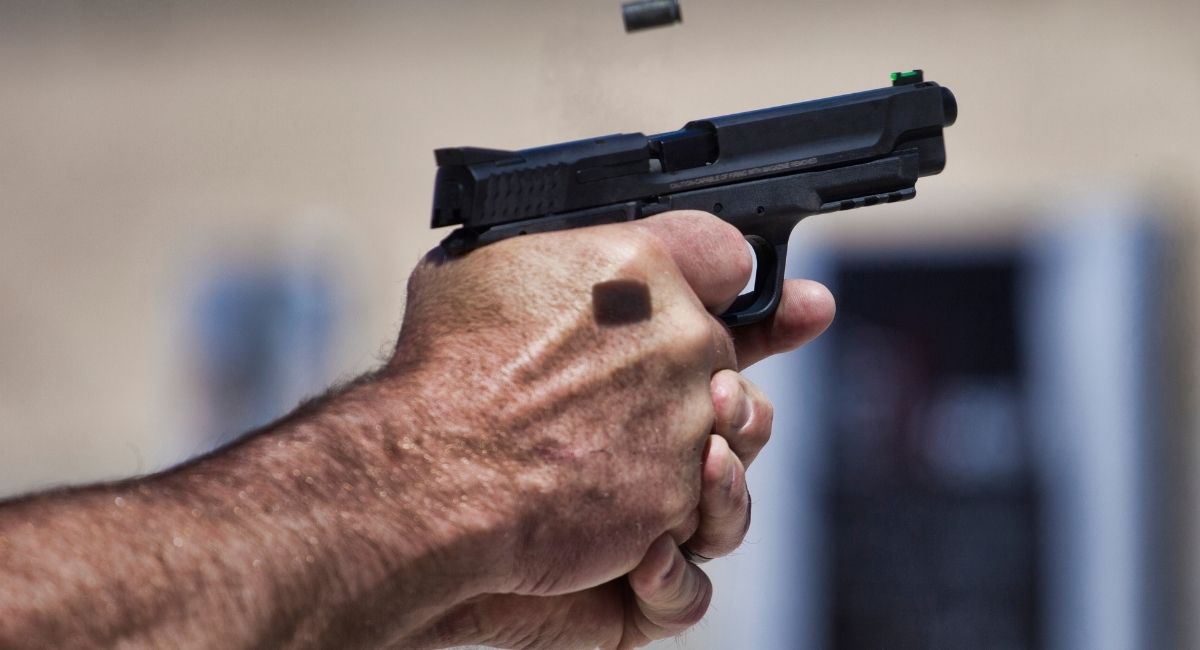 how should you hold a handgun for maximum accuracy