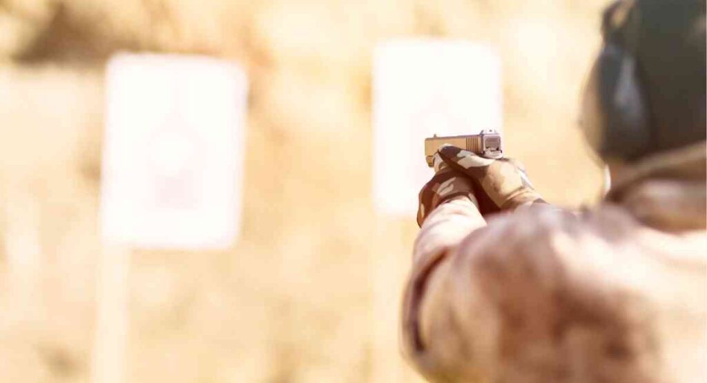 how should you hold a handgun for maximum accuracy